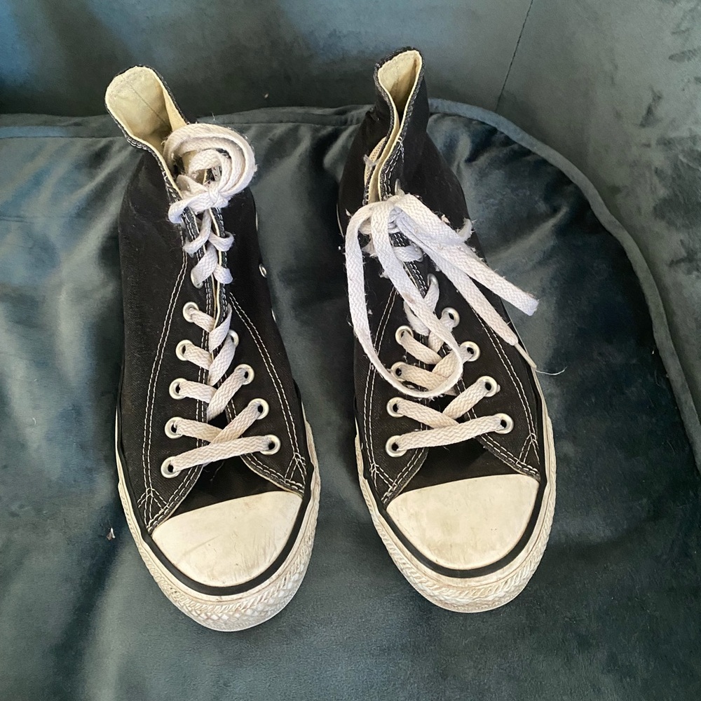 Black high tops Converse.  Size 9 in women’s and 7 in Men’s.  No rips or tears.